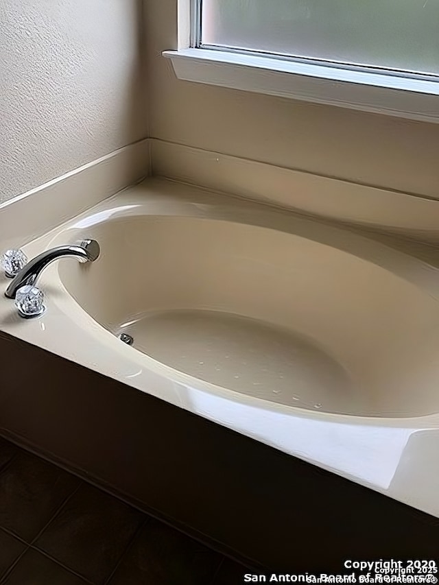 bathroom featuring a tub