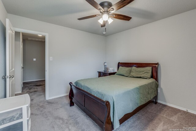 carpeted bedroom featuring ceiling fan and baseboards