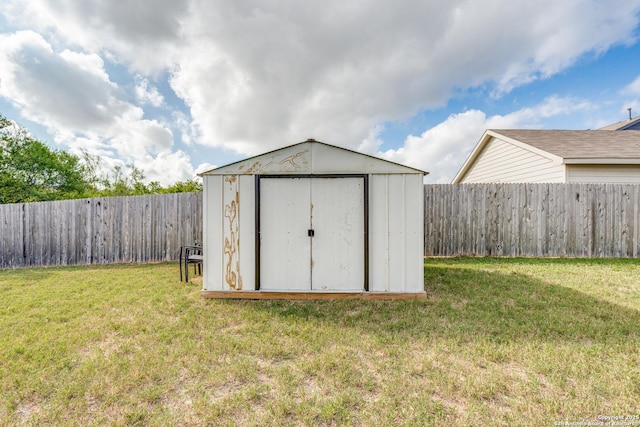 view of shed with a fenced backyard