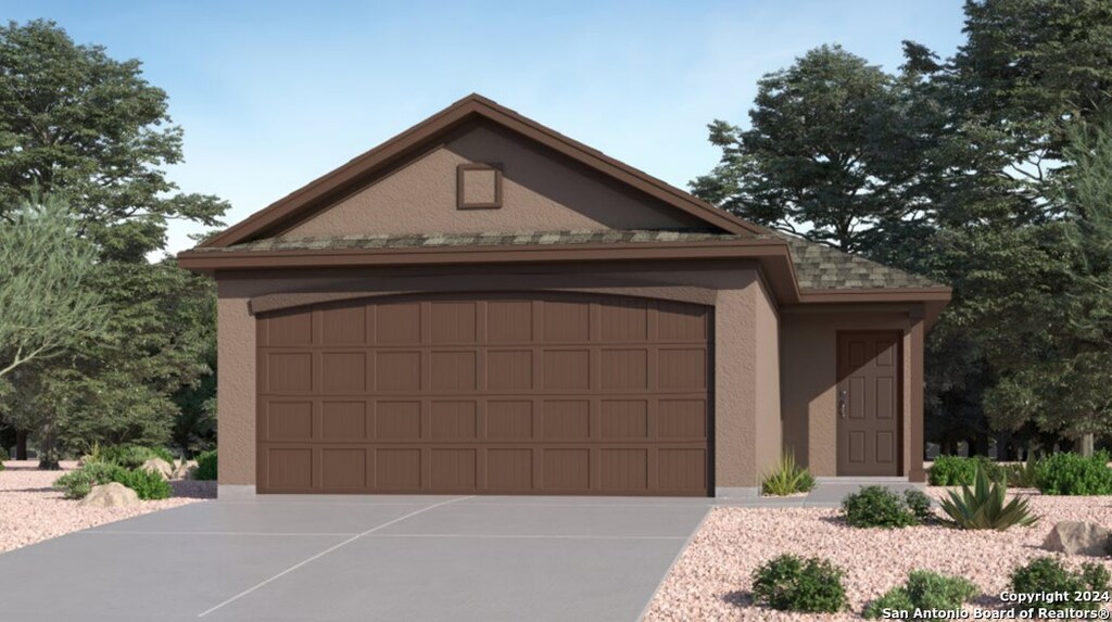 13618 Aston Mnr, San Antonio, TX 78253 - view of front of house featuring concrete driveway, an attached garage, and stucco siding