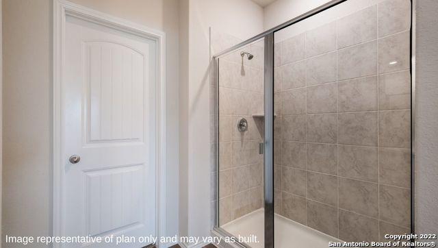 bathroom with a shower stall