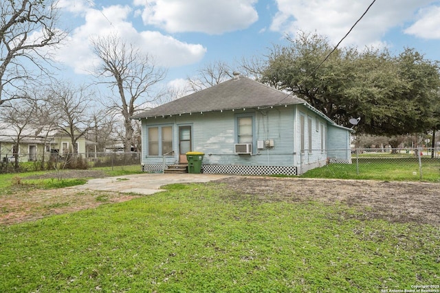 exterior space featuring entry steps, a yard, and fence