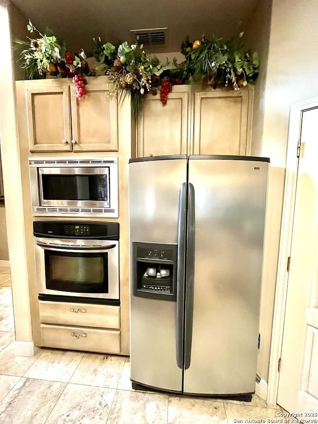 kitchen with visible vents and stainless steel appliances