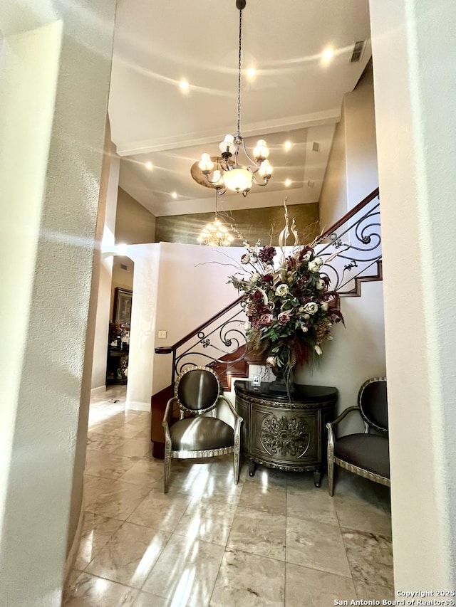 lobby featuring stairs and visible vents