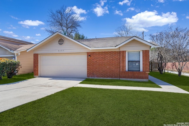 ranch-style home with a garage, driveway, a front lawn, and brick siding