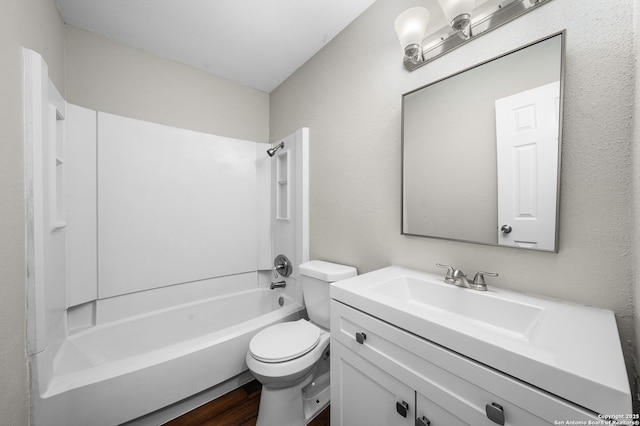 full bath featuring shower / bath combination, vanity, toilet, and wood finished floors