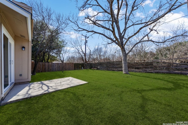 view of yard with a fenced backyard