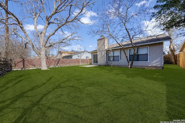 view of yard with a fenced backyard