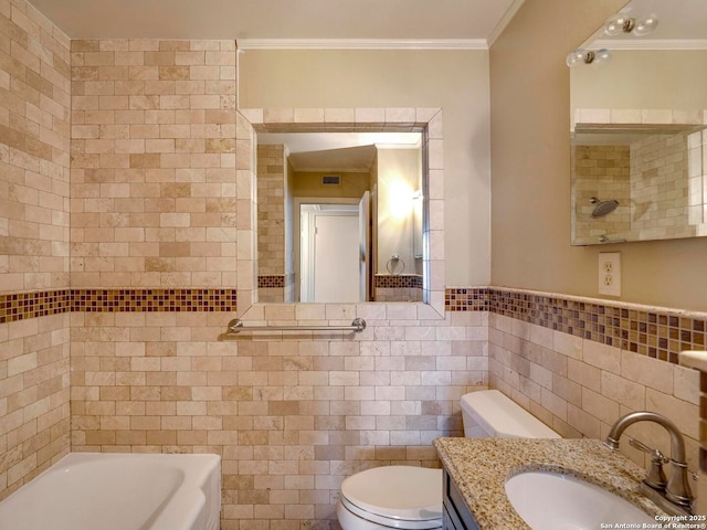 bathroom with toilet, a bathing tub, tile walls, vanity, and crown molding