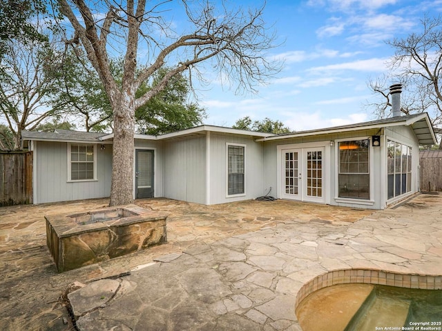 back of house with french doors, a patio area, and fence