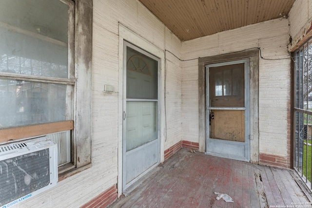 entrance to property with brick siding