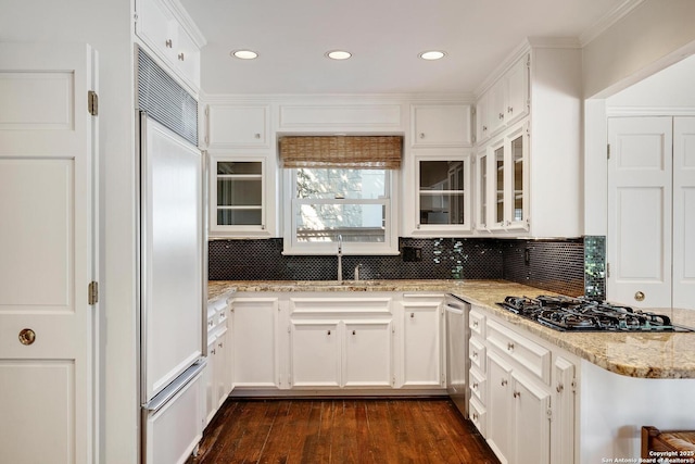 331 Ridgemont, Terrell Hills, TX 78209 - kitchen with built in refrigerator, black gas stovetop, recessed lighting, decorative backsplash, and white cabinetry