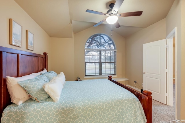 carpeted bedroom with vaulted ceiling and ceiling fan