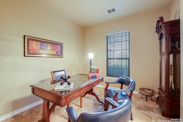 office area with visible vents and baseboards