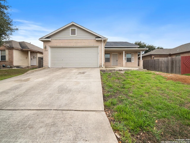 ranch-style home featuring a garage, concrete driveway, fence, a porch, and brick siding