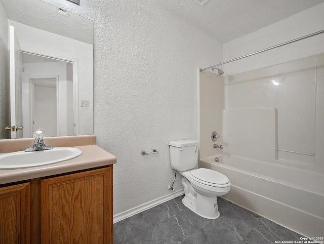 full bath with a textured wall, toilet, vanity, baseboards, and tub / shower combination