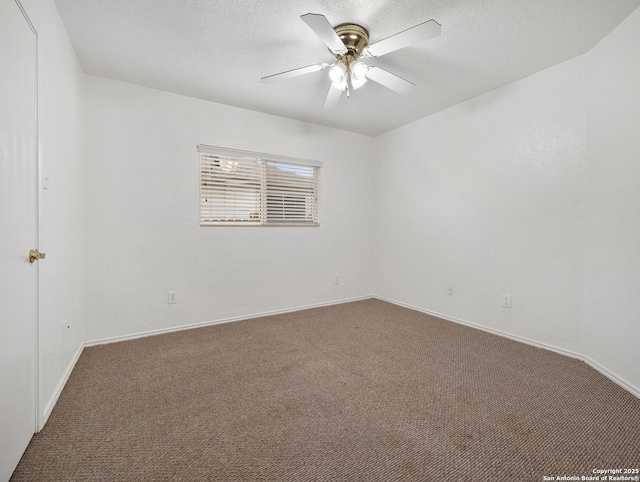 spare room featuring carpet floors, a textured ceiling, and a ceiling fan