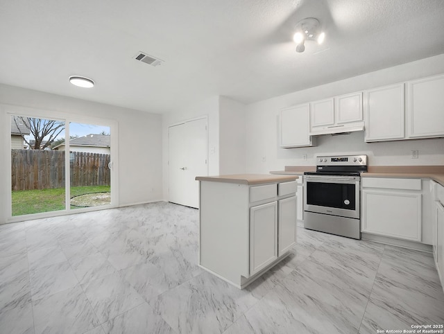 kitchen with visible vents, light countertops, white cabinetry, and stainless steel electric stove