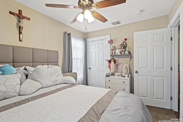 bedroom featuring ceiling fan and visible vents