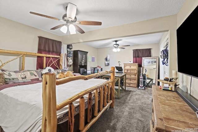 bedroom with a textured ceiling and carpet floors