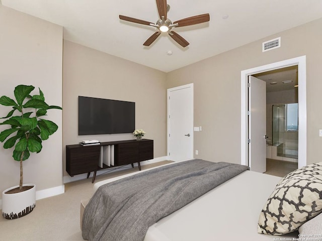 bedroom featuring light carpet, baseboards, visible vents, ceiling fan, and ensuite bathroom