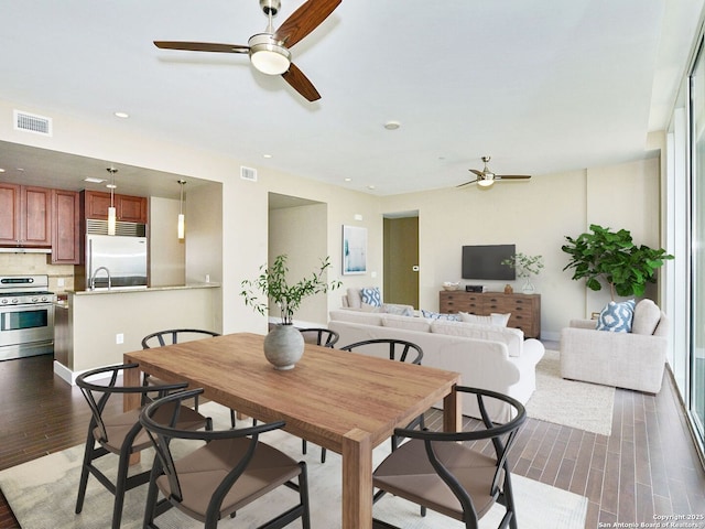 dining space featuring recessed lighting, visible vents, dark wood finished floors, and ceiling fan