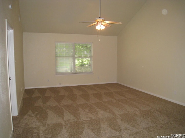 unfurnished room with a ceiling fan, carpet flooring, vaulted ceiling, and baseboards