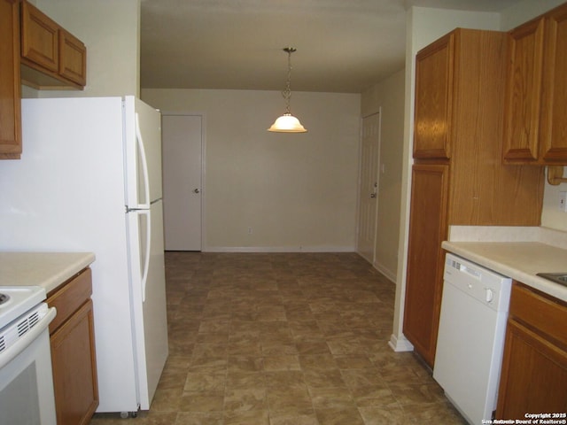 kitchen featuring white appliances, baseboards, brown cabinetry, decorative light fixtures, and light countertops