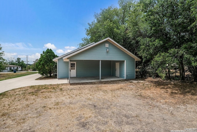 garage featuring a carport