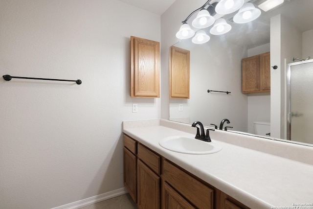 full bathroom with visible vents, toilet, an enclosed shower, vanity, and baseboards