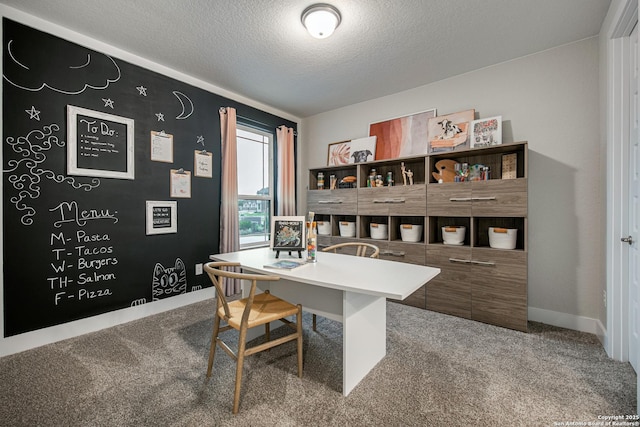 office featuring carpet floors and a textured ceiling