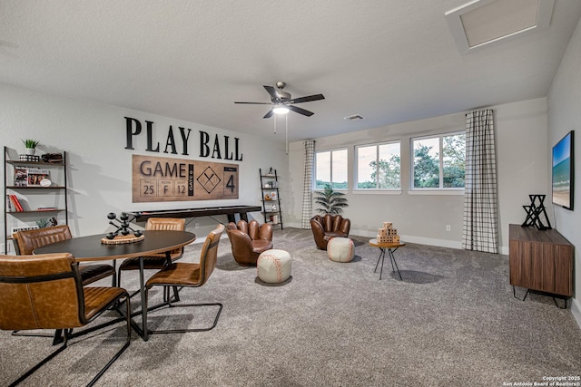 playroom featuring ceiling fan, a textured ceiling, visible vents, and carpet flooring