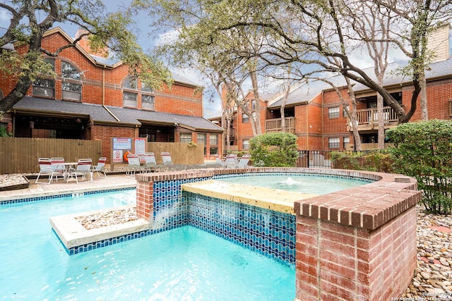 community pool with fence