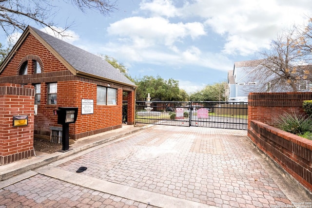 view of gate featuring fence