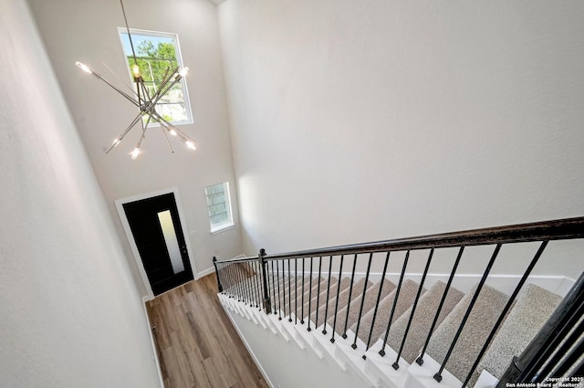 18414 Rhone Riv, San Antonio, TX 78256 - foyer entrance with a chandelier, wood finished floors, and a towering ceiling