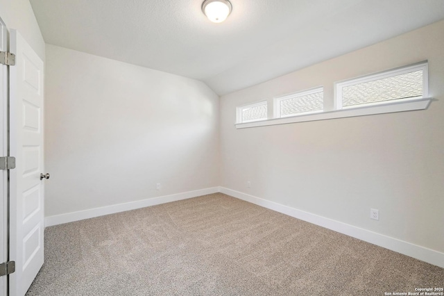 18414 Rhone Riv, San Antonio, TX 78256 - carpeted empty room featuring lofted ceiling and baseboards