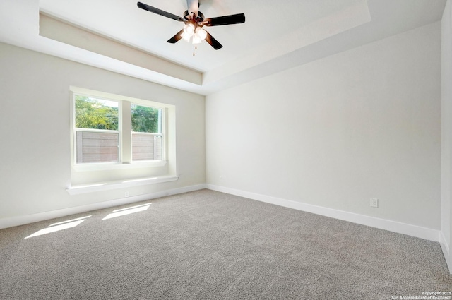 18414 Rhone Riv, San Antonio, TX 78256 - carpeted empty room featuring a raised ceiling and ceiling fan
