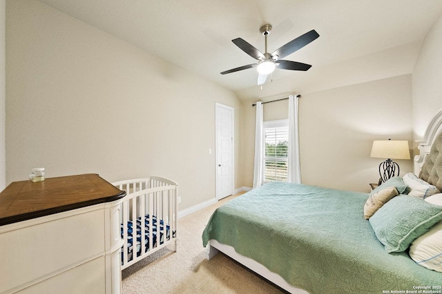 bedroom featuring ceiling fan, carpet flooring, and baseboards