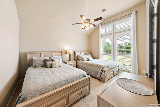 bedroom with vaulted ceiling, ceiling fan, light carpet, and visible vents