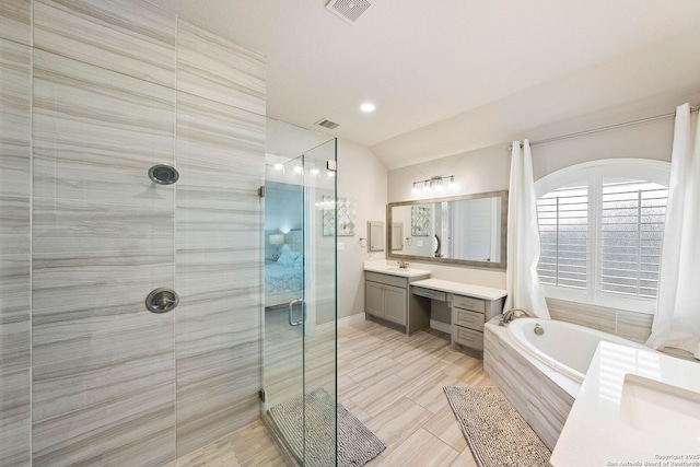 full bathroom featuring visible vents, lofted ceiling, vanity, a shower stall, and a bath