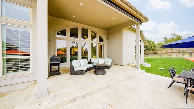 view of patio featuring fence and an outdoor living space