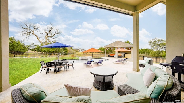 view of patio / terrace with outdoor dining space, a fenced backyard, an outdoor living space, and a gazebo