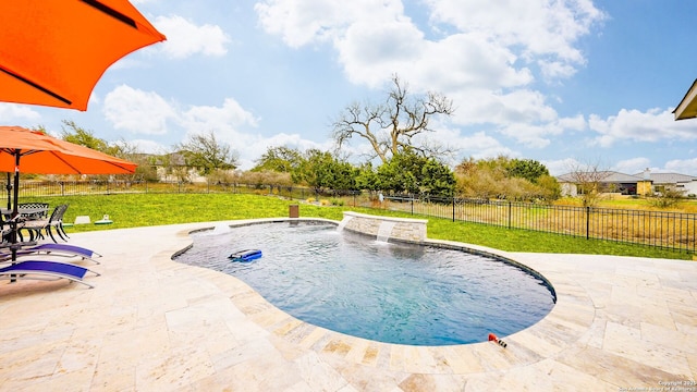 view of swimming pool featuring a fenced in pool, a patio area, a fenced backyard, and a lawn