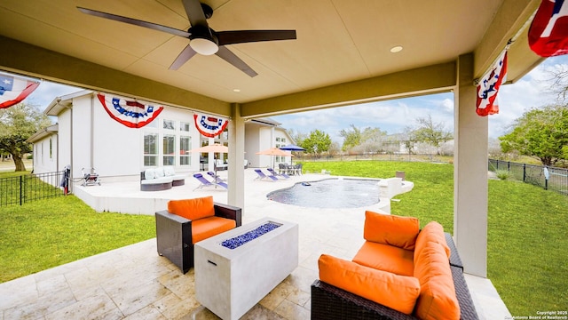 view of patio / terrace featuring an outdoor living space with a fire pit, ceiling fan, and a fenced backyard