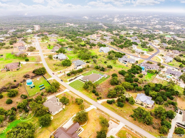 birds eye view of property with a residential view