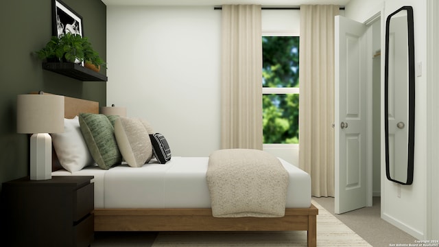 bedroom with light colored carpet