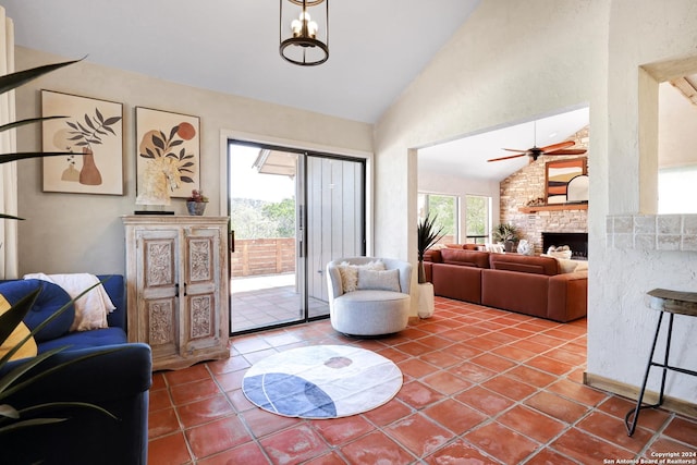 interior space featuring a large fireplace, high vaulted ceiling, and a ceiling fan