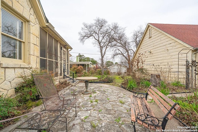 view of patio / terrace with a sunroom