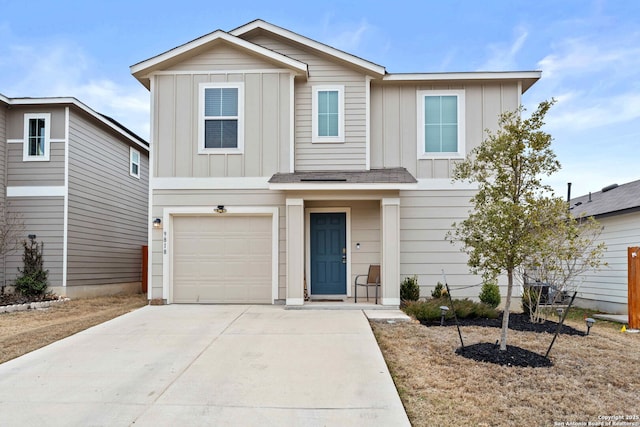 view of front of house with driveway, board and batten siding, and an attached garage