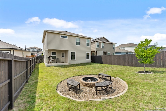 9818 Western Sedge, San Antonio, TX 78254 - rear view of house with a fenced backyard, a fire pit, and a yard
